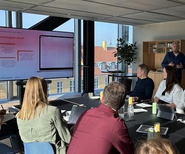 Group sitting at table during expert meeting
