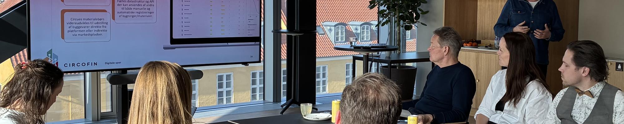 Group sitting at table during expert meeting